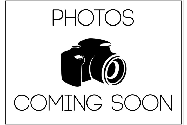 Illustration of a camera with text 'Photos Coming Soon'.